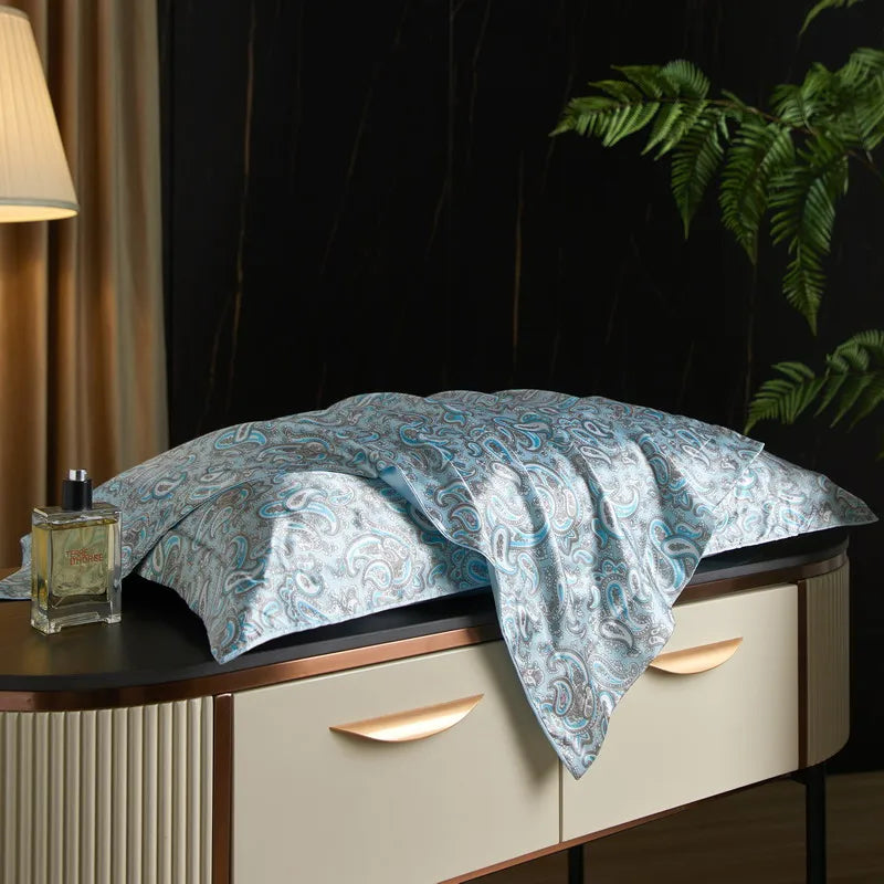 Blue Meadow print on the Daylilt Meadow Drift silk-blend pillowcase pair