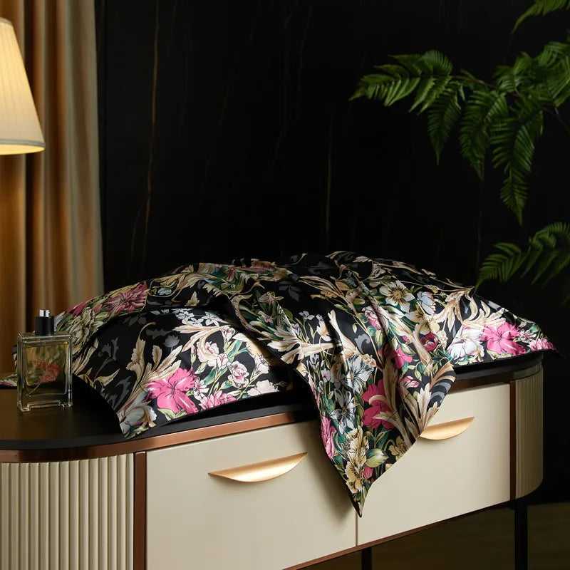 Midnight Bloom print on the Daylilt Meadow Drift silk-blend pillowcase pair